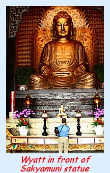 Wyatt in front of the Sakyamuni statue